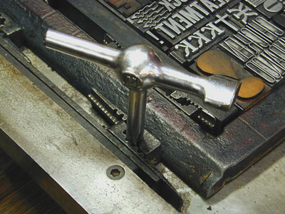The quoin key needed to tighten quoins and lock type into place